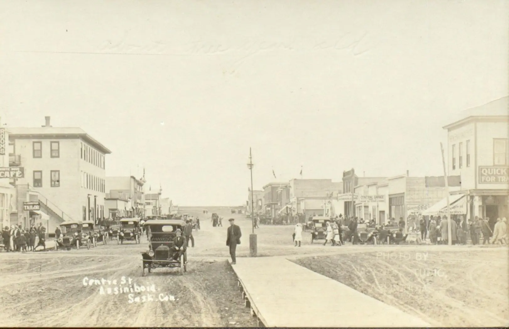 Centre Street, Assiniboia, with early cars and crowds